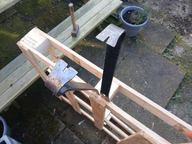 Double pry bar technique for pallet breaking.