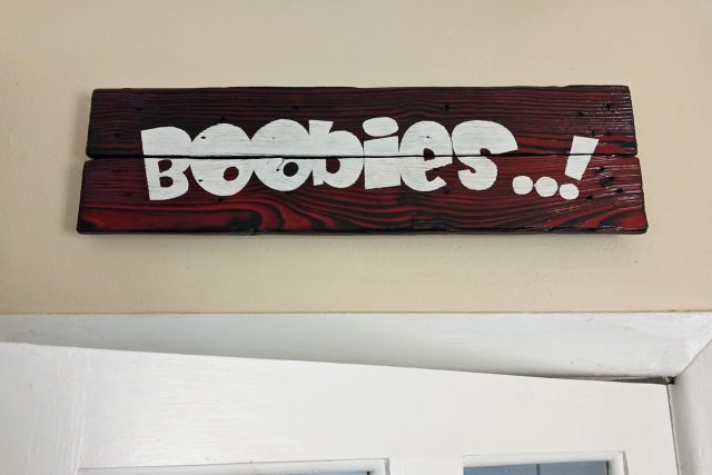 Handcrafted Homewares: Red Yakisugi sign with the word "BOOBIES..!" painted on.