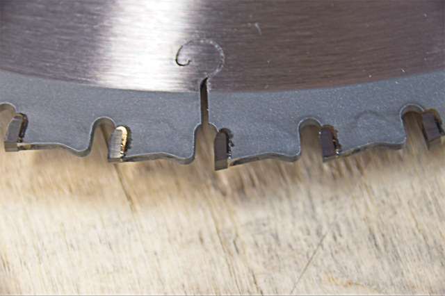 A close-up of Circular Saw Blades with Negative Hook/Rake Teeth.