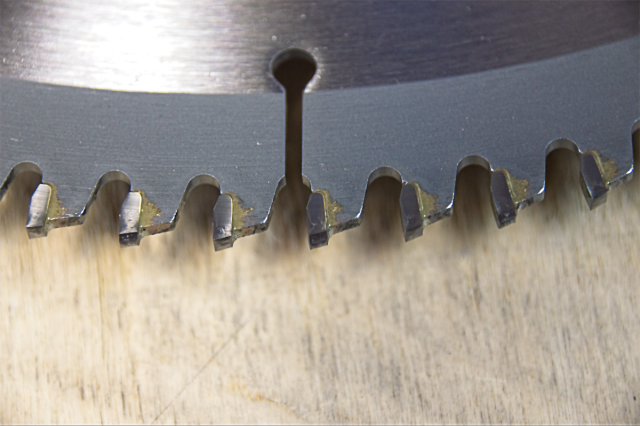 A close-up of Circular Saw Blade Teeth with a zero degree hook/rake.
