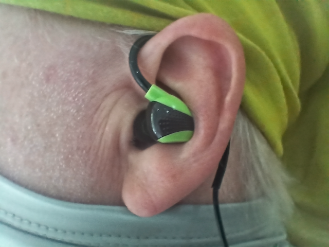 ISOtunes Pro Aware 2.0 Earphones inserted over ear.