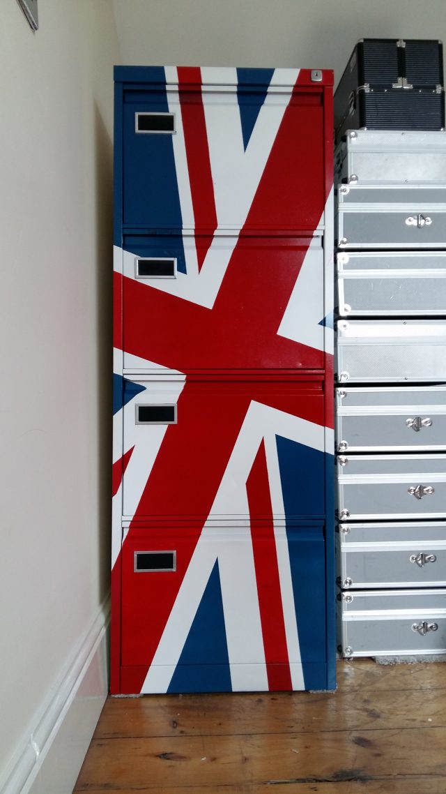 An image of the front of a four-drawer filing cabinet, painted in the colours of the UK Union Flag.