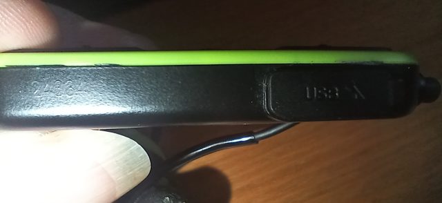 Close-up of the control unit of the ISOtunes Pro Aware 2.0 earphones.