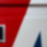 A blurred close-up of the front of a Union Flag Filing Cabinet Drawer.