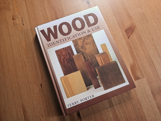 The cover of the Wood Indentification & Use book, by Terry Porter. Shown on a wooden background.