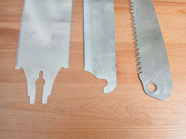 Image shows three ZETSAW replacement blades, detailing the different handle fixing types. From left to right; screw fit, hook fit and pin fit.